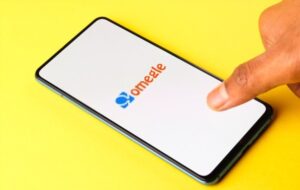 Hands using Omegle on mobile